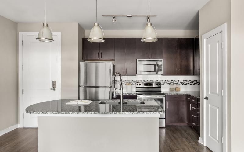 a kitchen with a marble island