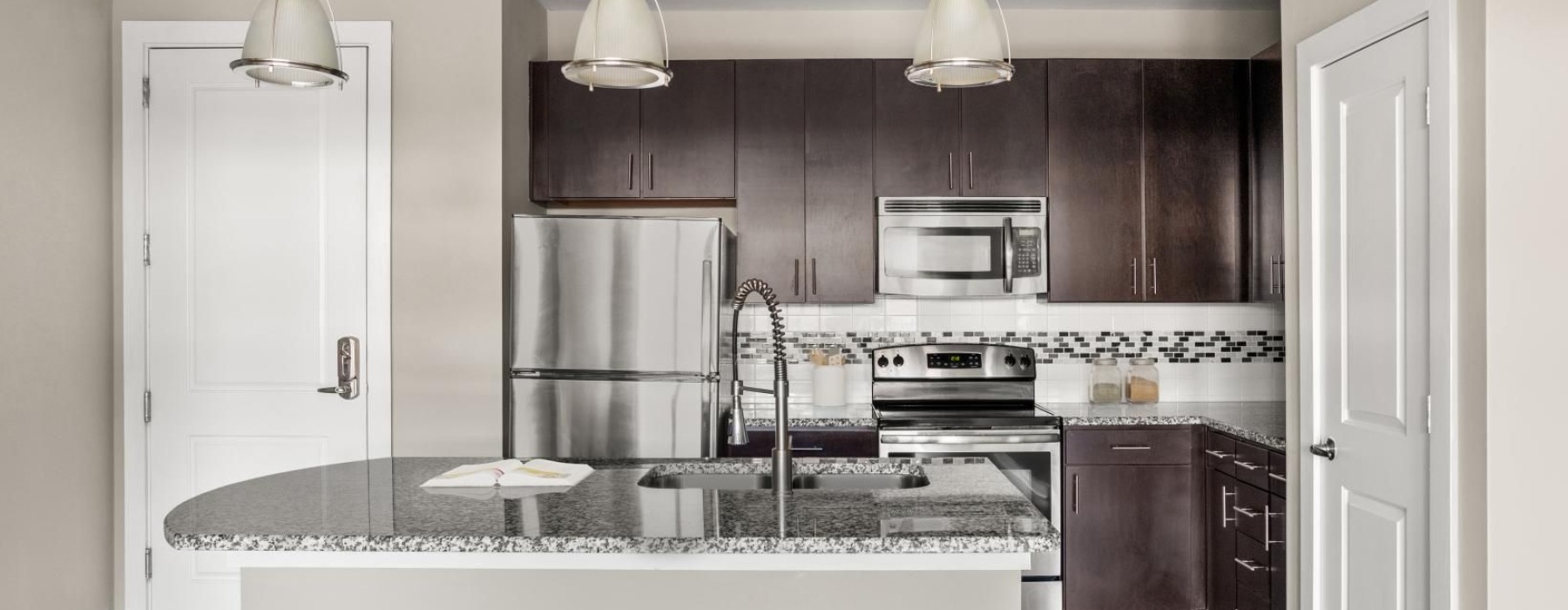 a kitchen with a marble island