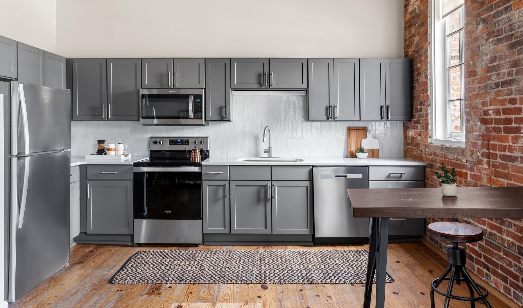 a kitchen with black appliances