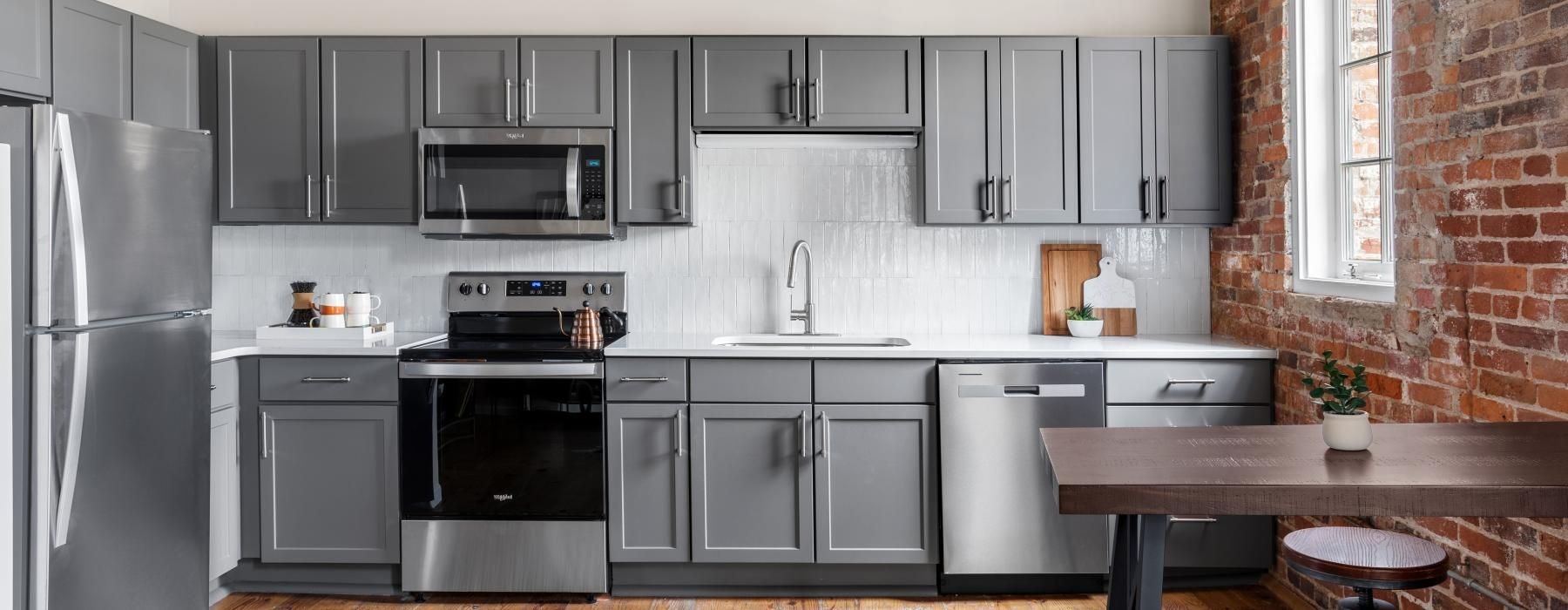 a kitchen with black appliances