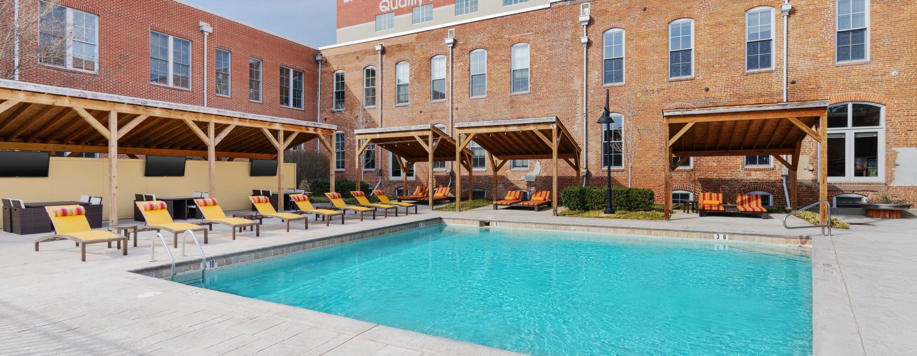 a swimming pool in front of a building